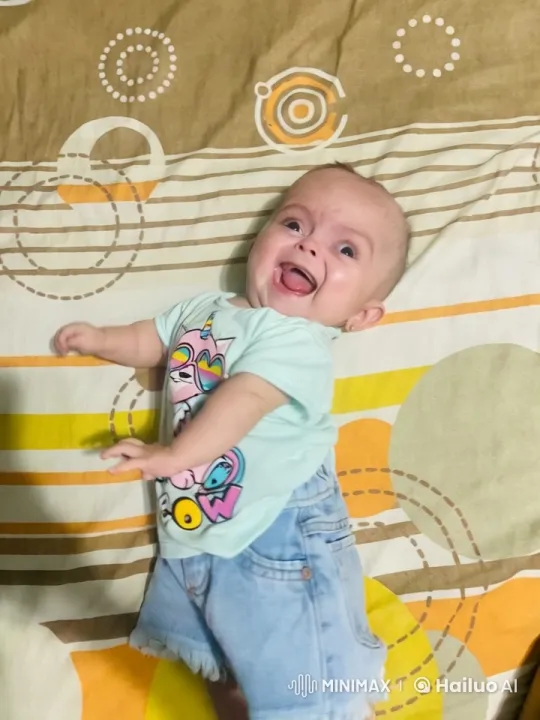 Baby Dancing Joyfully on Colorful Bed – AI Generated Video | Hailuo AI