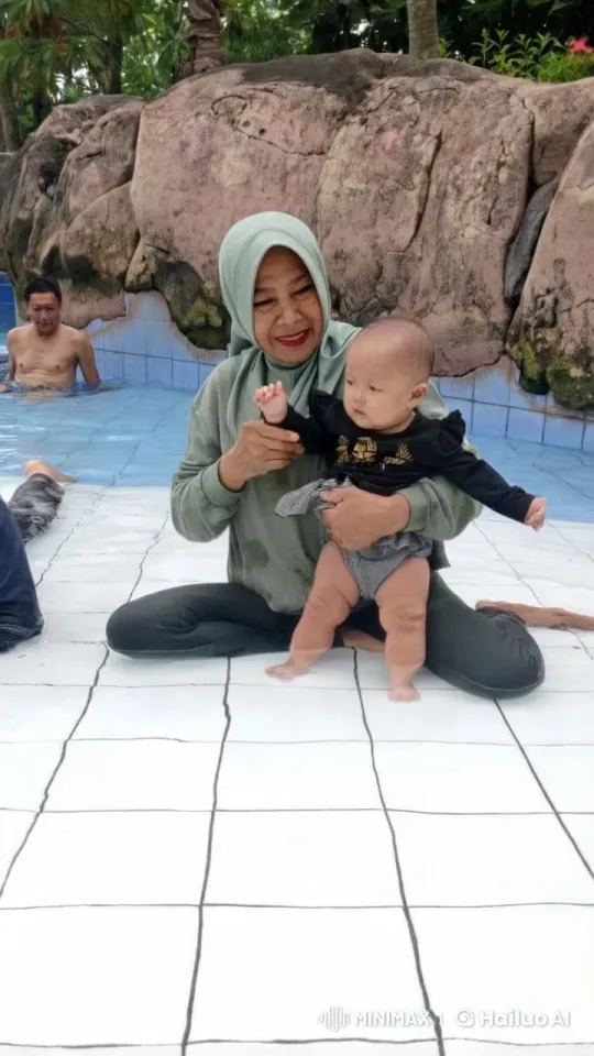 Woman and Baby Perform Kungfu in Pool Area – AI Generated Video | Hailuo AI