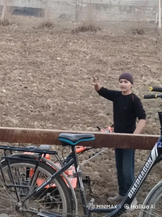 Young Individual Gestures in Rural Field with Bicycle – AI Generated Video | Hailuo AI