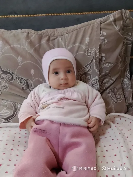 Baby's Gentle Dance in Cozy Pink Outfit – AI Generated Video | Hailuo AI