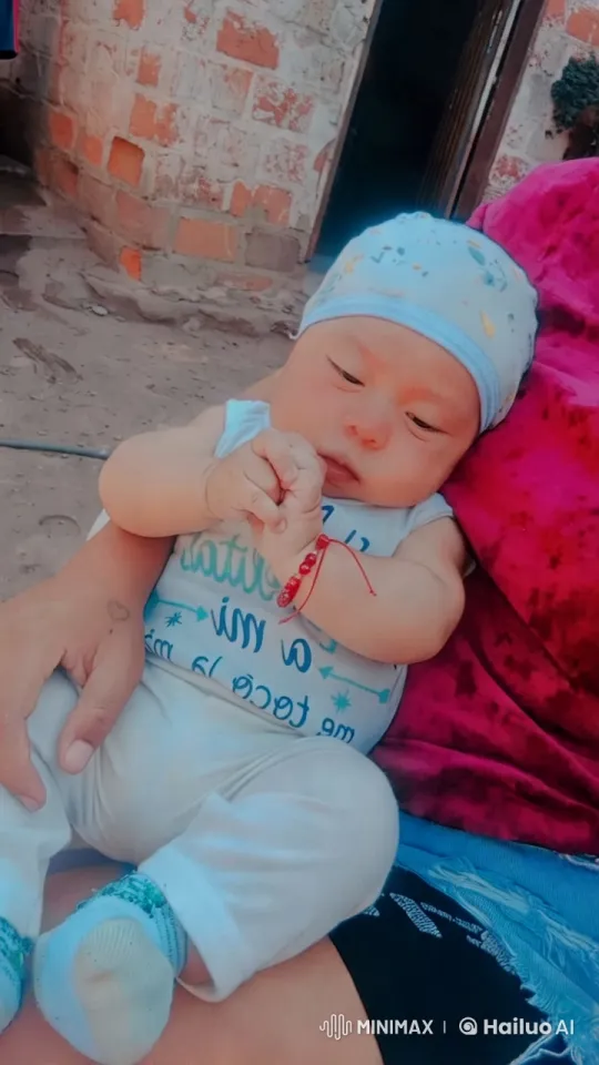 Baby in Blue Outfit Cradled Outdoors – AI Generated Video | Hailuo AI