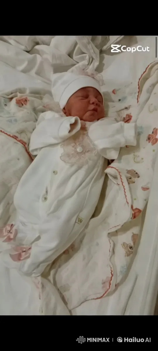 Newborn's Serene Rest in Delicate Onesie – AI Generated Video | Hailuo AI