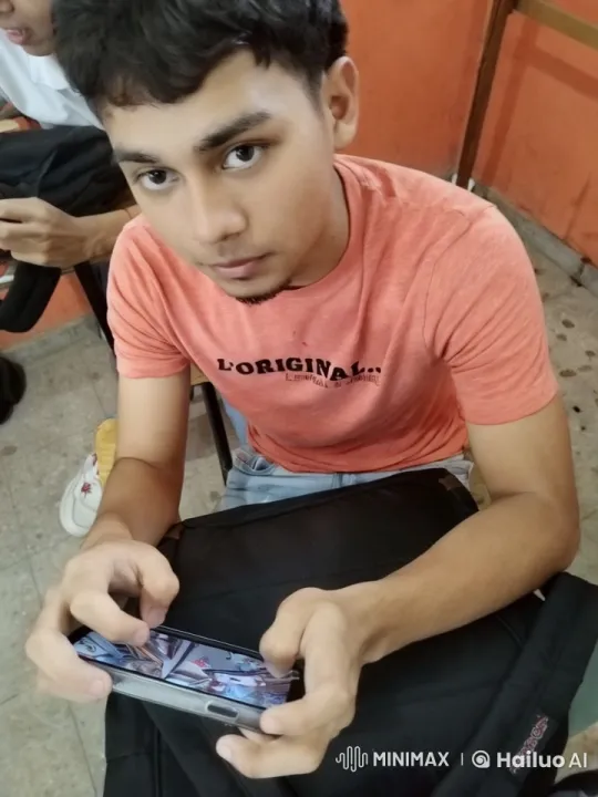 Young Man in Orange T-Shirt Kisses Another Man – AI Generated Video | Hailuo AI