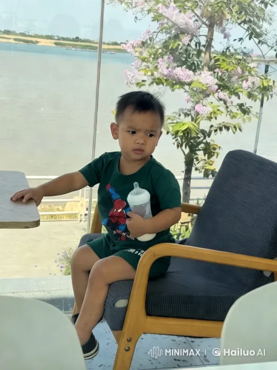 Boy's Joyful Dance and Kung Fu Moves by Riverside – AI Generated Video | Hailuo AI