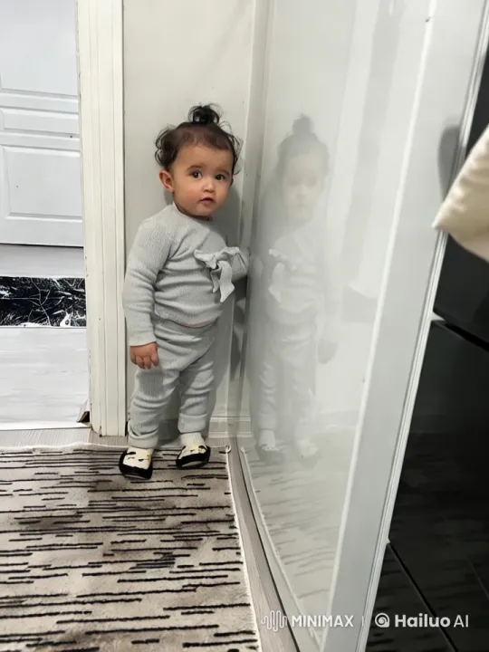 Curious Baby Explores Room with Reflective Charm – AI Generated Video | Hailuo AI