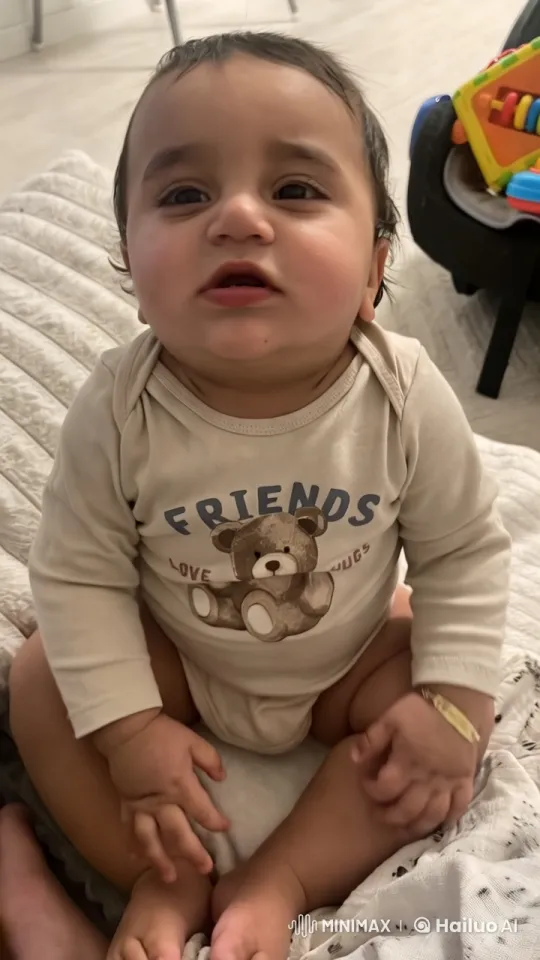 Baby Dancing Playfully in Quilted Blanket Scene – AI Generated Video | Hailuo AI