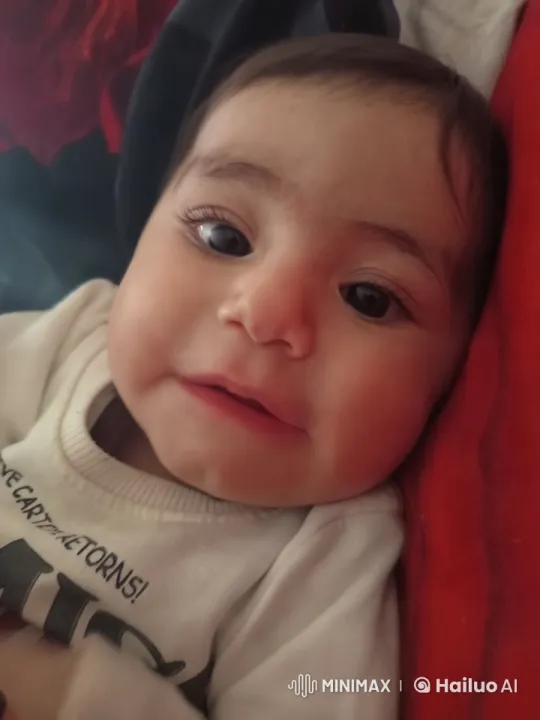 Baby's Serene Moments Captured in Soft-Lit Scene – AI Generated Video | Hailuo AI