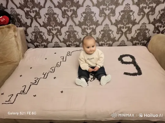 Child Rests on Numbered Blanket in Serene Setting – AI Generated Video | Hailuo AI