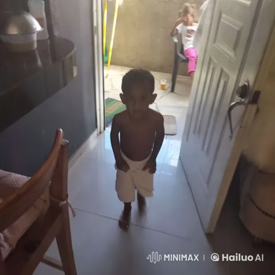 Young Boy Dancing in Dimly Lit House – AI Generated Video | Hailuo AI