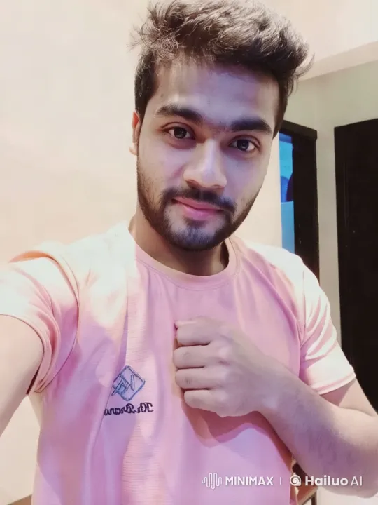 Young Man in Pink Shirt in Welcoming Room – AI Generated Video | Hailuo AI