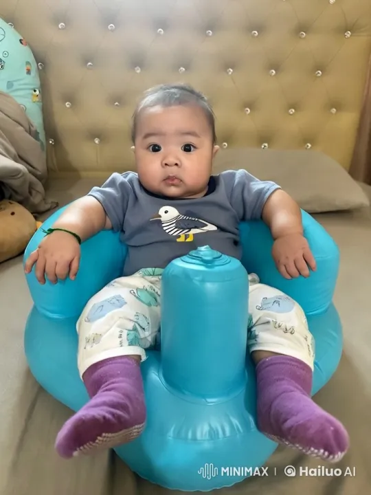 Baby Dancing in Inflatable Seat with Stylish Background – AI Generated Video | Hailuo AI