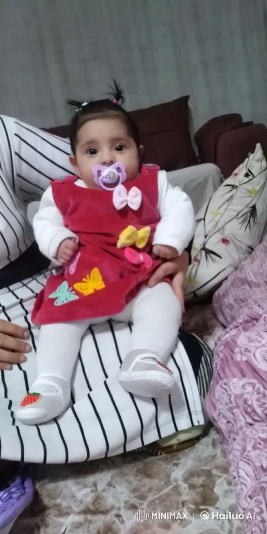 Baby Dancing on Lap in Colorful Outfit and Cozy Living Room – AI Generated Video | Hailuo AI