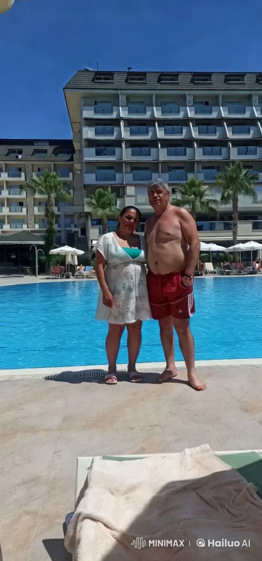 Luxurious Hotel Poolside Couple Relaxation Scene – AI Generated Video | Hailuo AI