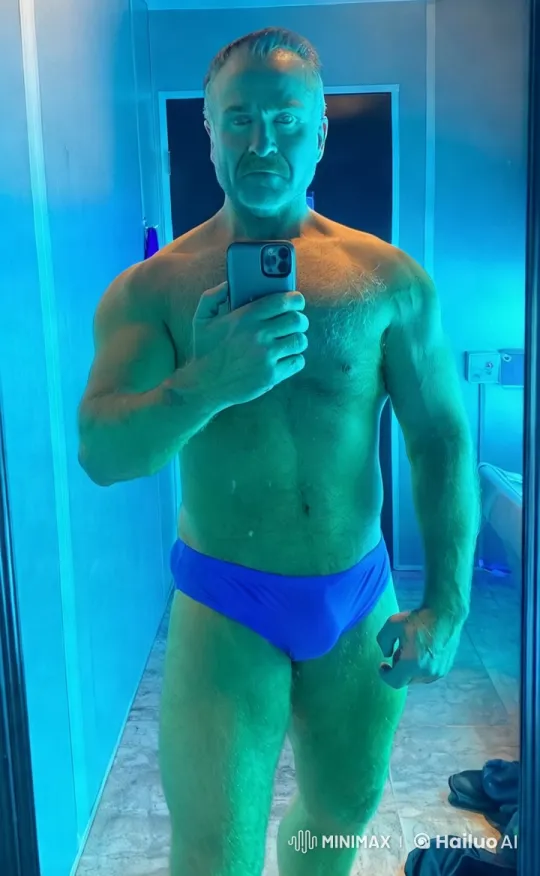 Muscular Man Takes Dynamic Mirror Selfie with Lightning Effects – AI Generated Video | Hailuo AI