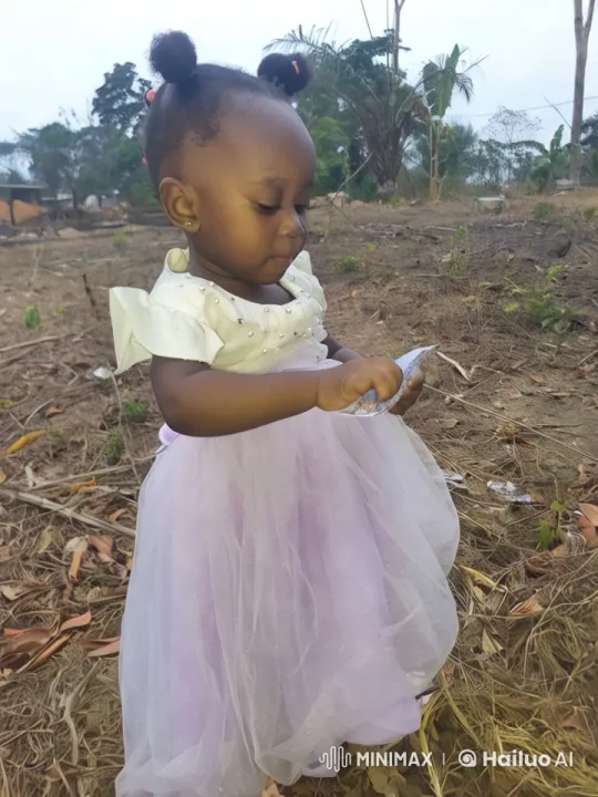Elegant Little Girl in Nature Examines Object – AI Generated Video | Hailuo AI