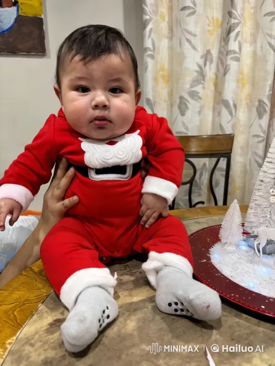 Baby in Santa Outfit Delights with Dance and Play – AI Generated Video | Hailuo AI