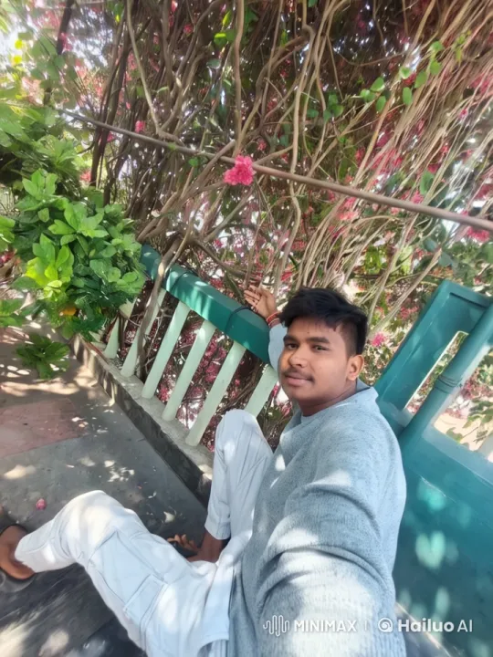 Young Man in Nature: Serene Portrait with Greenery – AI Generated Video | Hailuo AI