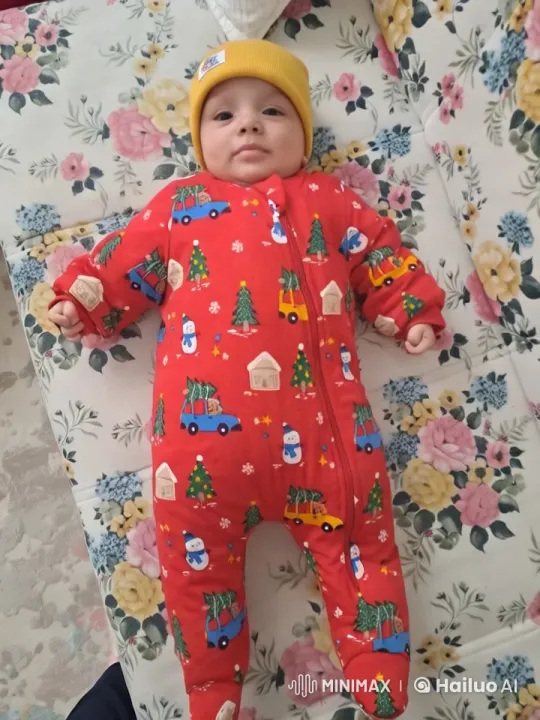 Baby Dancing in Festive Onesie on Floral Bed – AI Generated Video | Hailuo AI