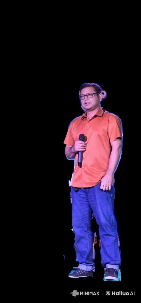 Man in Bright Colors on Dark Stage Holding Microphone – AI Generated Video | Hailuo AI