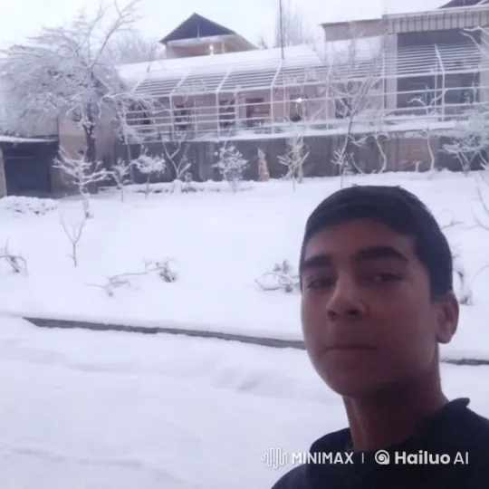 Young Man Reflects in Winter Landscape with Modern House – AI Generated Video | Hailuo AI
