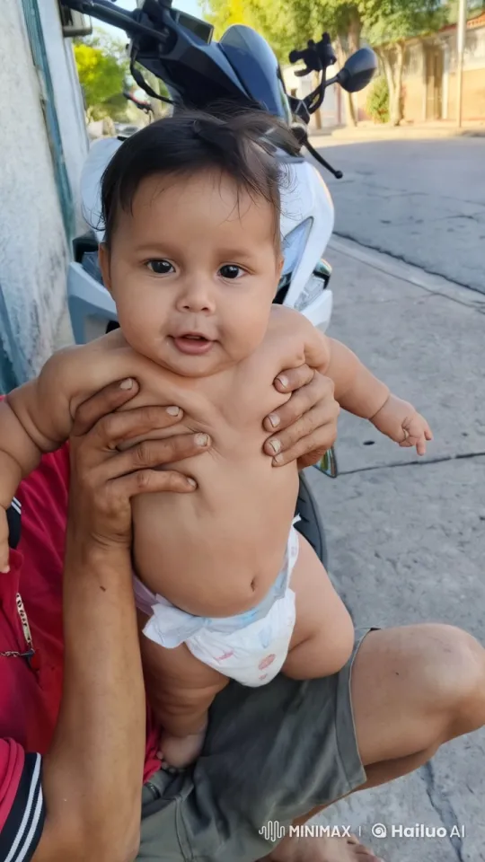 Baby Dancing on Adult's Lap in Serene Street Setting – AI Generated Video | Hailuo AI