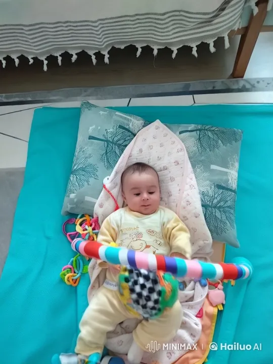 Baby's Playful Interaction on Colorful Play Mat – AI Generated Video | Hailuo AI