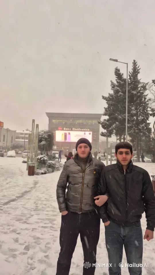 Snowy Urban Scene with Men and Electronic Billboard – AI Generated Video | Hailuo AI