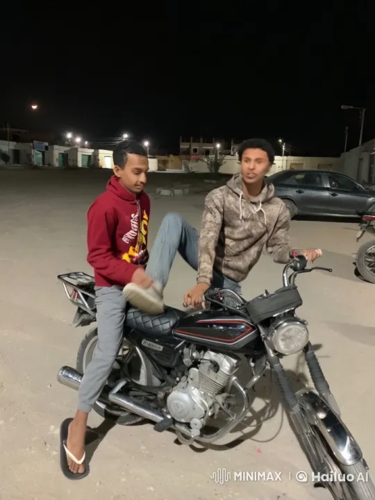 Nighttime Playful Fight Between Friends on Motorcycle – AI Generated Video | Hailuo AI