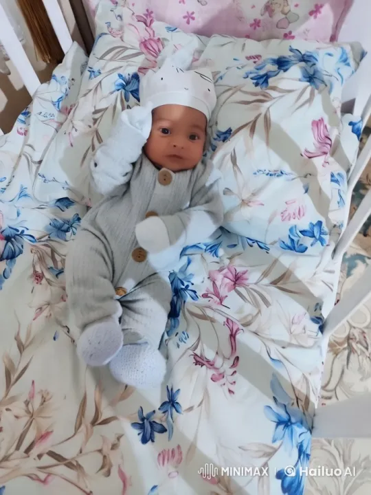 Baby's Playful Kung Fu Dance on Floral Bedspread – AI Generated Video | Hailuo AI