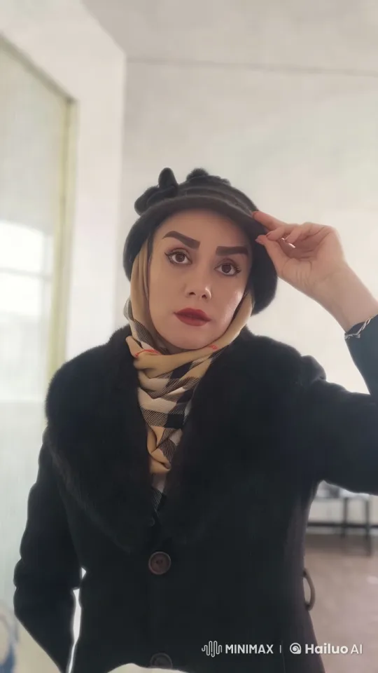 Woman in Elegant Black Coat Adjusts Hat in Well-Lit Room – AI Generated Video | Hailuo AI