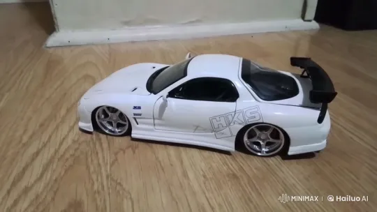 Sleek White Sports Car Showcases Design on Wood Floor – AI Generated Video | Hailuo AI