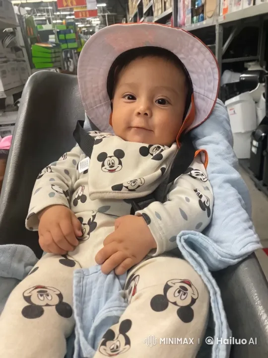 Baby in Mickey Onesie Amidst Store's Bustle – AI Generated Video | Hailuo AI