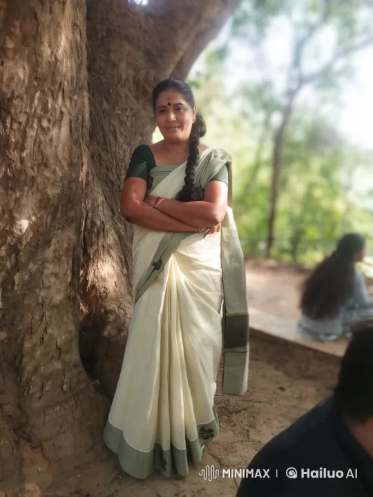 Woman in White Saree Amidst Serene Outdoor Nature Scene – AI Generated Video | Hailuo AI