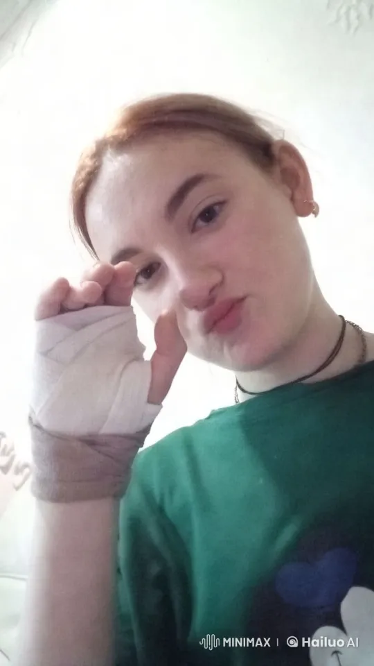 Portrait of a Bandaged Hand and Green Shirt – AI Generated Video | Hailuo AI