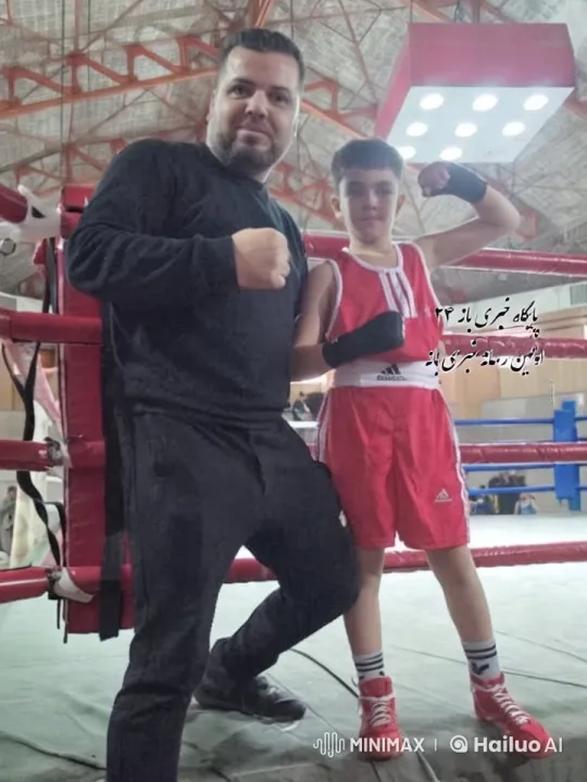 Young Boxer and Coach Celebrate Victory in Ring – AI Generated Video | Hailuo AI