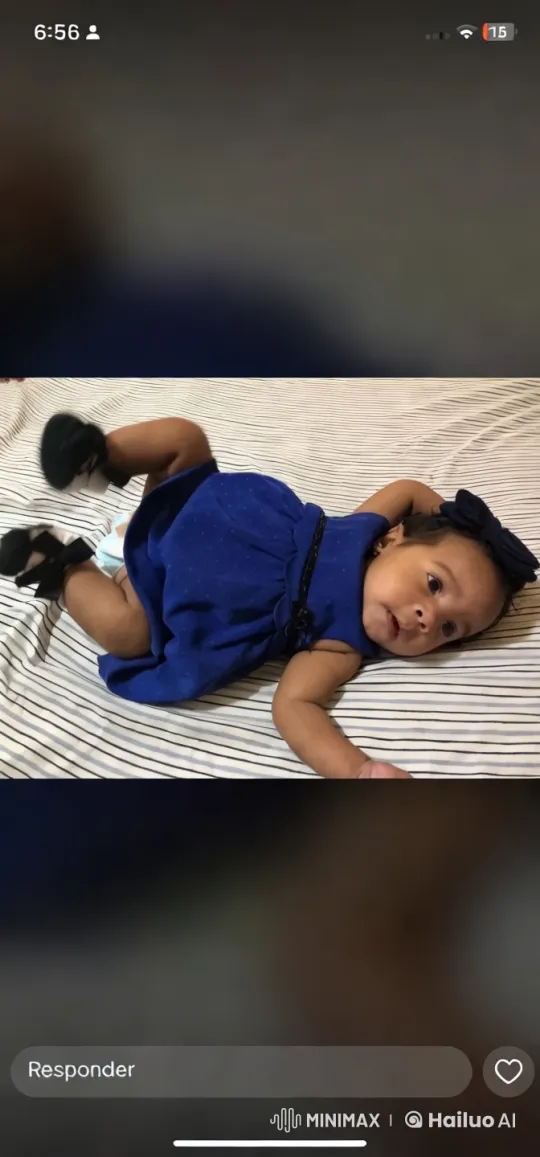 Baby Showcases Blue Dress on Striped Bed – AI Generated Video | Hailuo AI