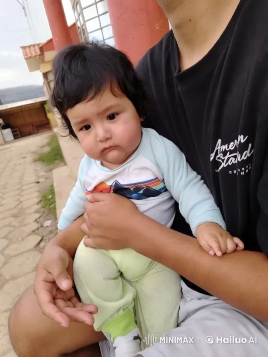 Kung Fu Master and Child Perform Gracefully in Rustic Setting – AI Generated Video | Hailuo AI