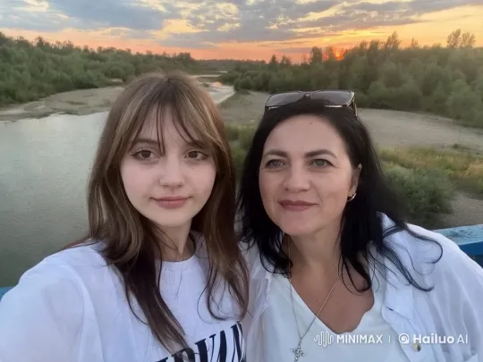 Two Women Enjoying Scenic Sunset Over Tranquil River – AI Generated Video | Hailuo AI