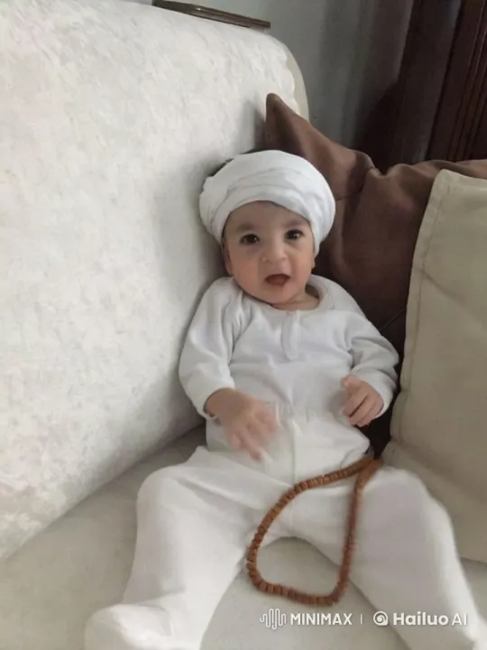 Baby's Joyful Kung Fu Dance on Neutral-Tone Couch – AI Generated Video | Hailuo AI