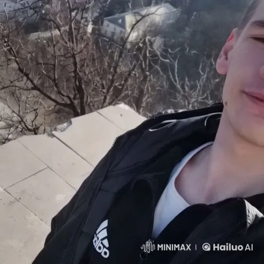 Young Man on Winter Platform Amidst Emerging Smoke – AI Generated Video | Hailuo AI