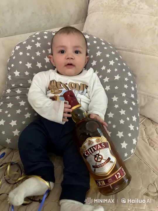Baby with Whisky Bottle on Star Cushion – AI Generated Video | Hailuo AI