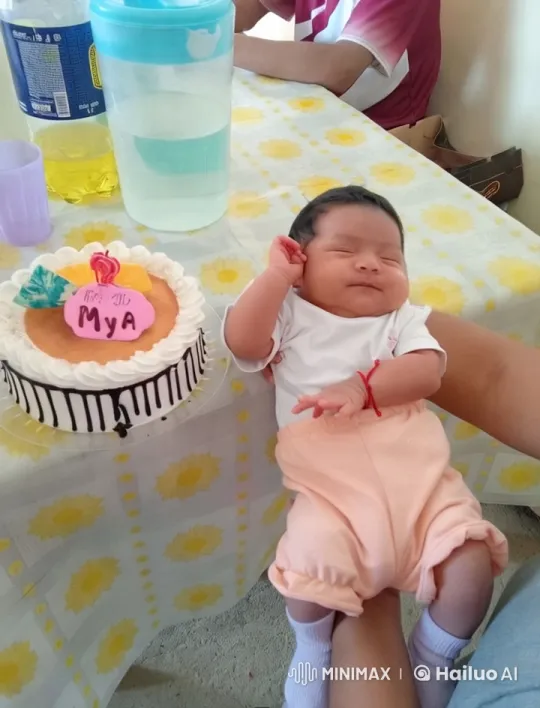 Baby Celebrates with Cake on Lap, Smiles and Sways – AI Generated Video | Hailuo AI