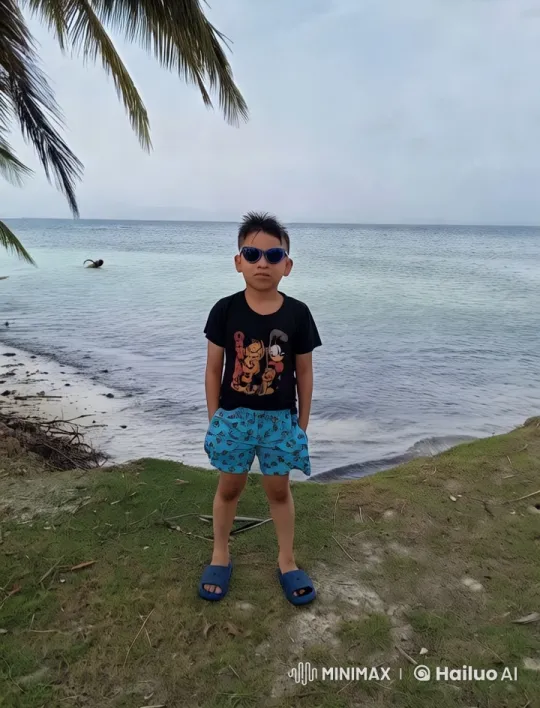 Boy Dancing Joyfully on Shoreline with Vibrant Outfit – AI Generated Video | Hailuo AI
