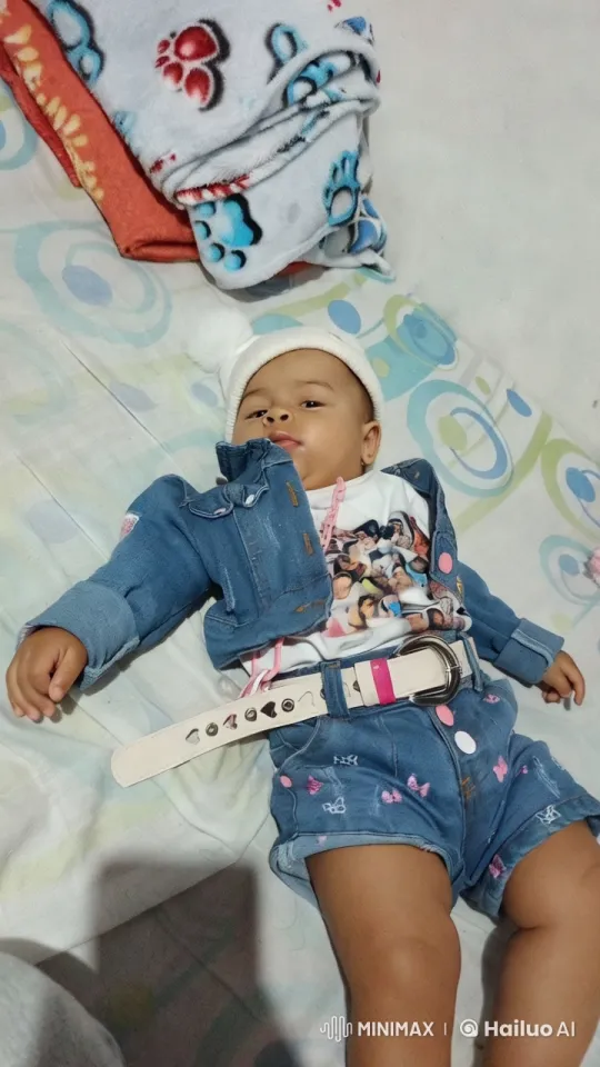 Baby in Cozy, Colorful Denim Outfit on Playful Bed – AI Generated Video | Hailuo AI