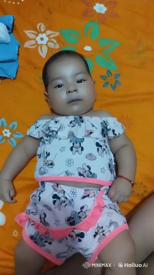 Baby Dancing with Joy in Cute Outfit on Floral Bedspread – AI Generated Video | Hailuo AI