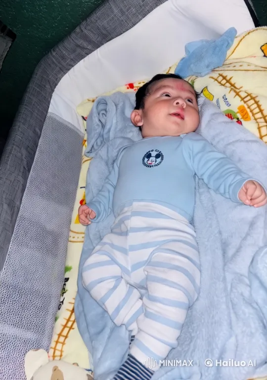 Baby in Cozy Crib with Colorful Blankets and Toys – AI Generated Video | Hailuo AI