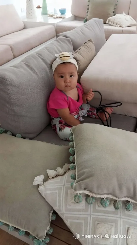 Baby Distressed with Toy Amid Cozy Living Room Decor – AI Generated Video | Hailuo AI