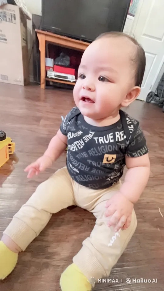 Baby on Floor Examined in Aesthetic Home Setting – AI Generated Video | Hailuo AI