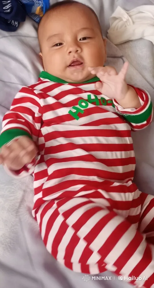 Festive Baby in Cozy Pajamas on Joyful Bed – AI Generated Video | Hailuo AI