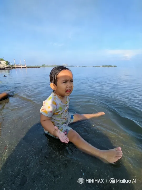 Boy Playing at Seashore Captures Joyful Atmosphere – AI Generated Video | Hailuo AI